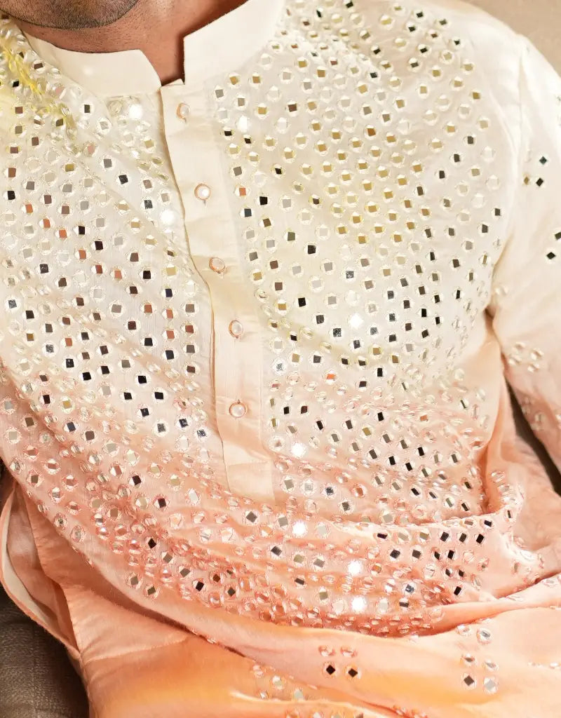Close-up of a Blush Radiance Mirrorwork Kurta with intricate beadwork and gradient color.