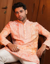 A man wearing a Coral Bloom Zardozi Kurta from The HUB.