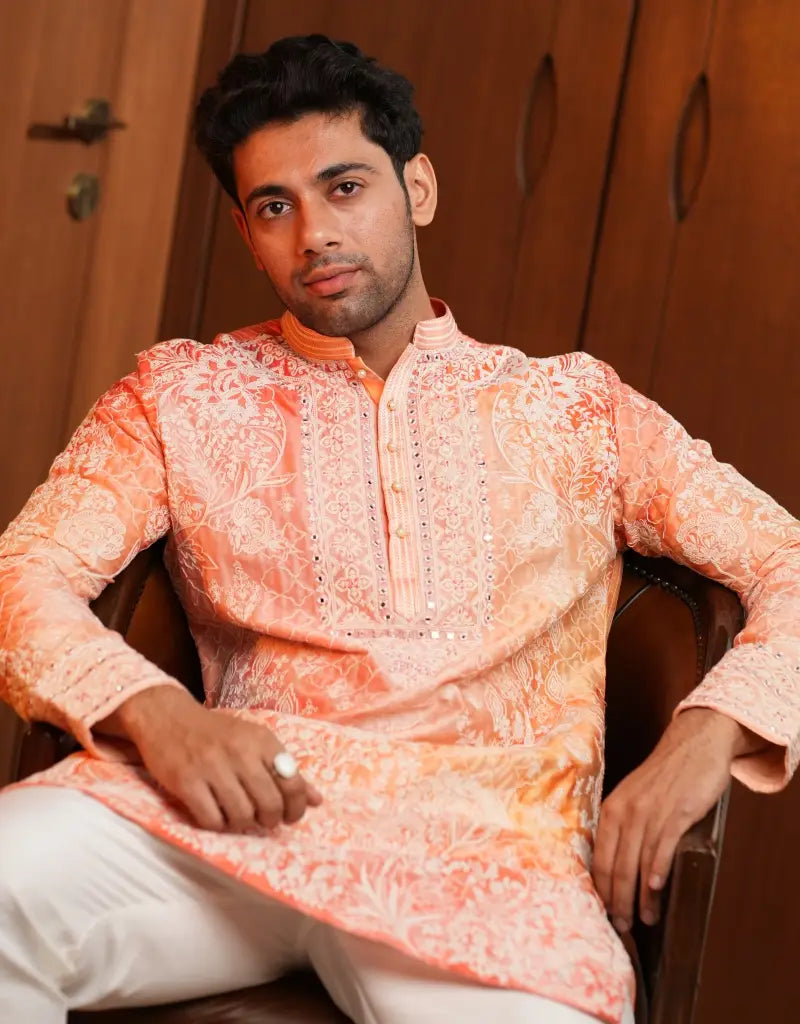 A man wearing a Coral Bloom Zardozi Kurta from The HUB.