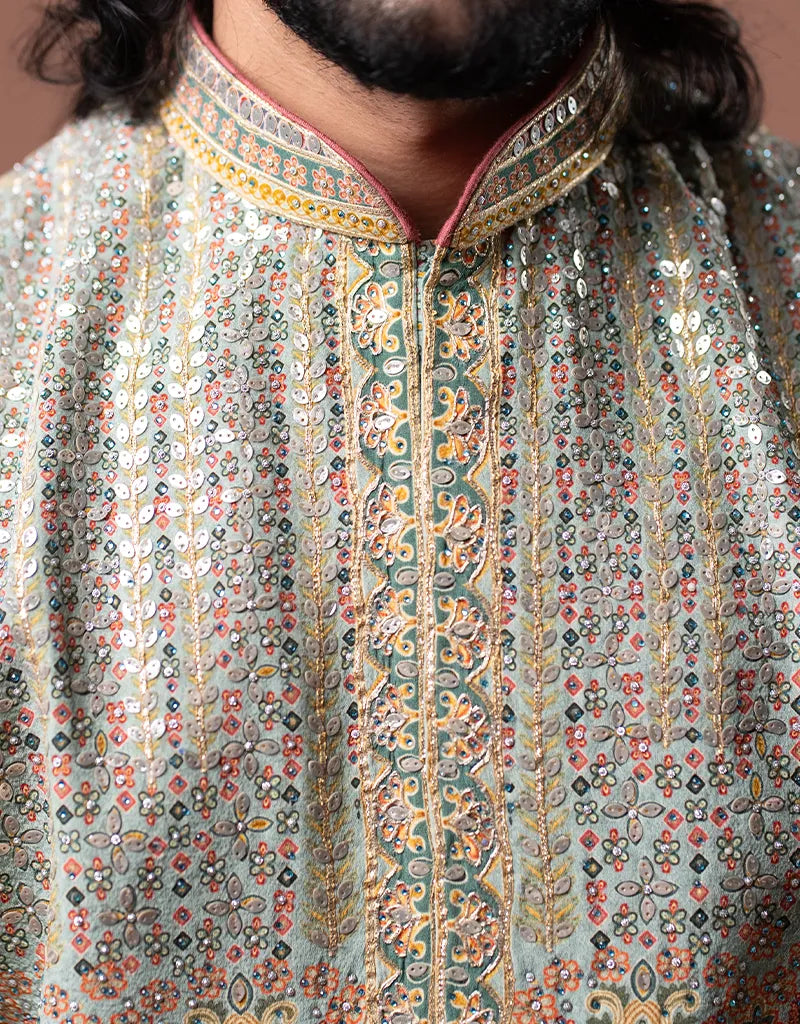 Close-up of a person wearing a traditional embroidered Kalamkari Gotta Bandi Kurta Set outfit with intricate patterns.