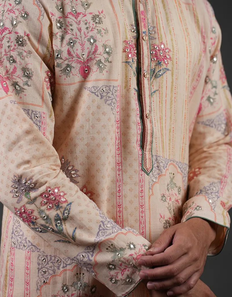 Close-up of a cream-colored embroidered traditional Khadi Mirror Work Kurta with floral patterns and embellishments.