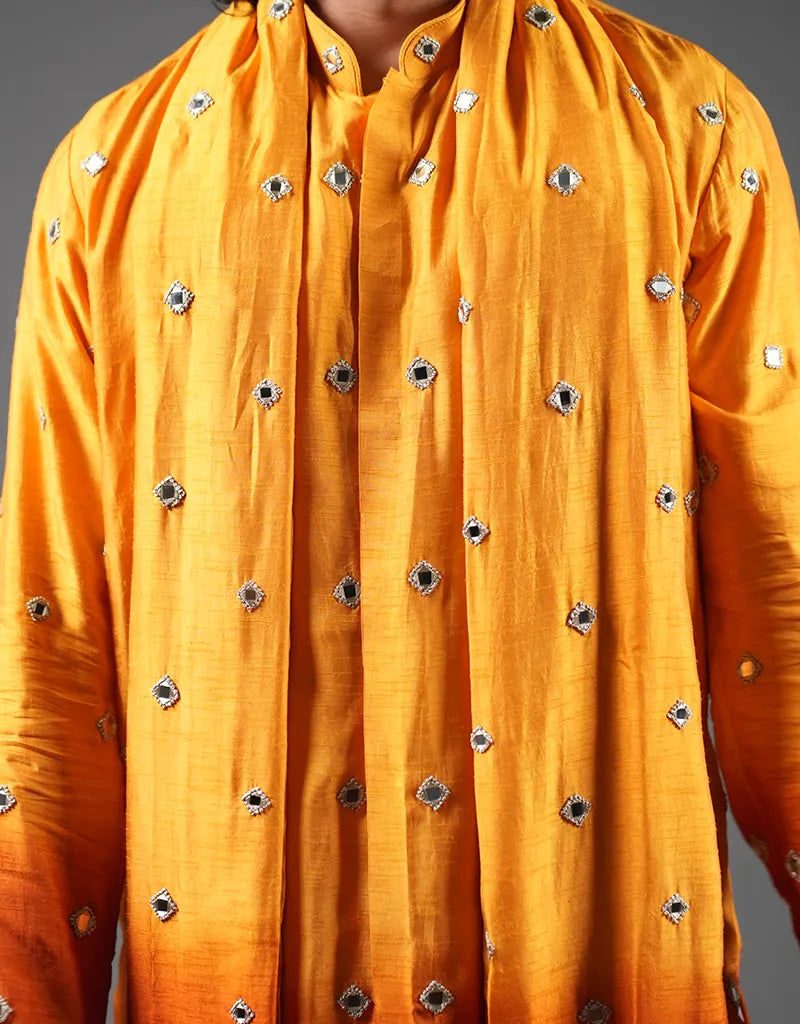 Yellow kurta with decorative buttons on a gray background