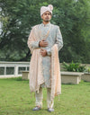 A man wearing Three-piece Sherwani in Raw Silk with Kardana work in Grey from The HUB.