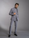Man wearing a three-piece Jodhpuri suit in the Bandhgala style in grey from The HUB.