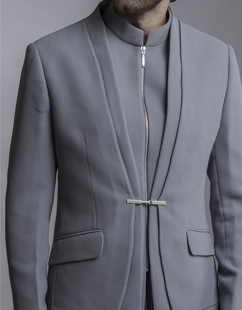 Man wearing a three-piece Jodhpuri suit in the Bandhgala style in grey from The HUB.