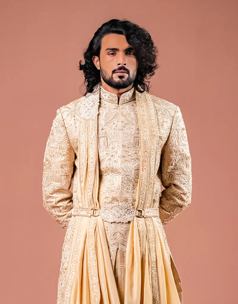 A man wearing the Royal Silk Sherwani Set from The HUB.