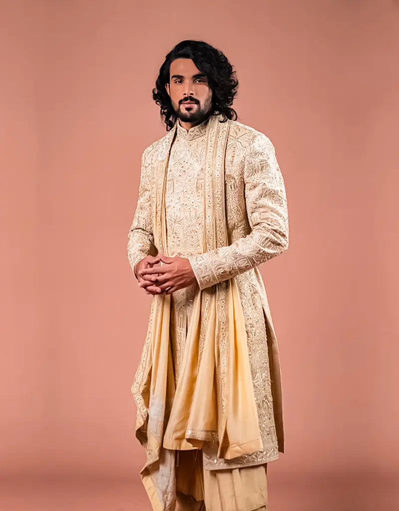 A man wearing the Royal Silk Sherwani Set from The HUB.
