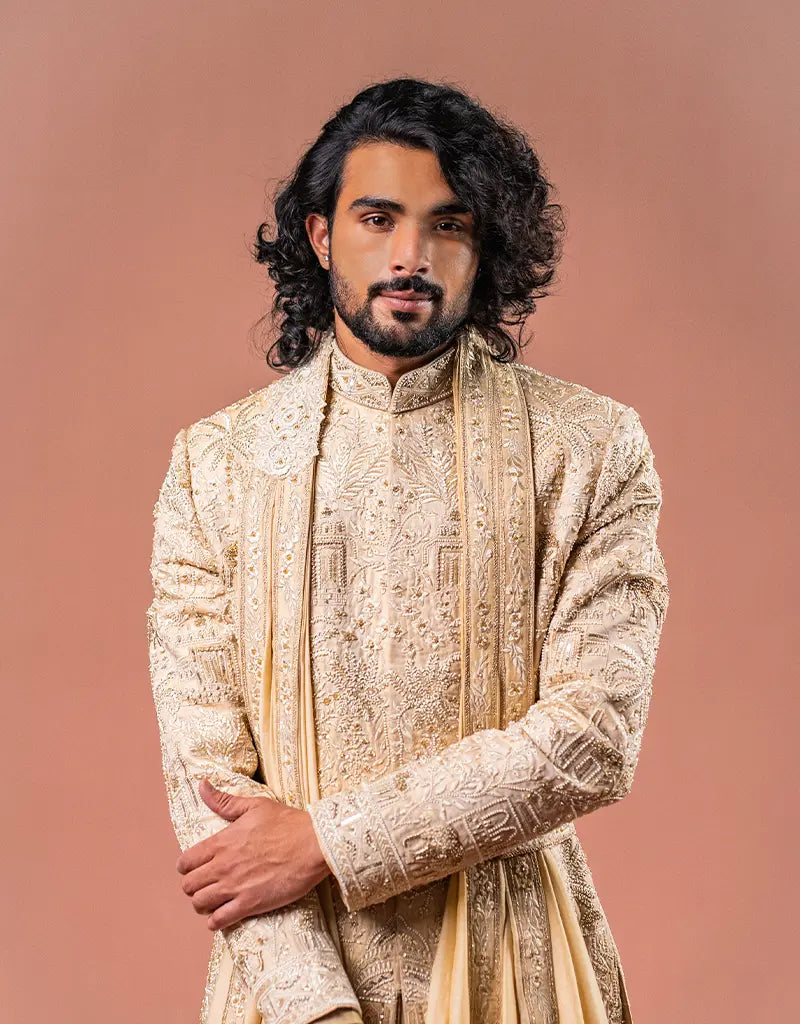 A man wearing the Royal Silk Sherwani Set from The HUB.