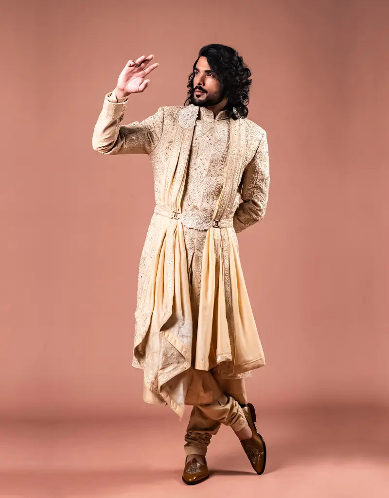 A man wearing the Royal Silk Sherwani Set from The HUB.