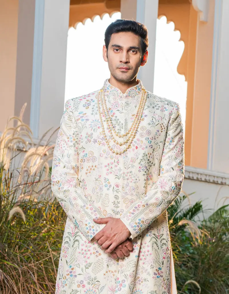 A man wearing a floral work sherwani from The HUB.