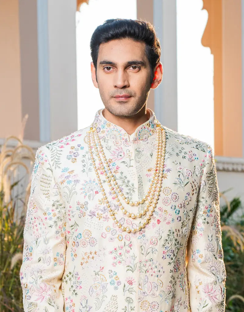 A man wearing a floral work sherwani from The HUB.