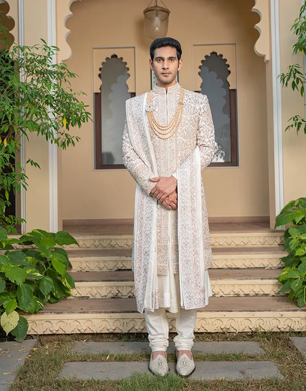 groom wearing sherwani at wedding event